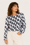Blouse rose pâle fleurie