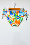 Bas de maillot de bain orange et bleu (m) -- La Penderie du Paradis ?