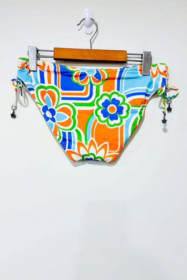 Bas de maillot de bain orange et bleu (m) -- La Penderie du Paradis ?