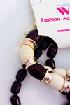Bracelets extensibles en perles brunes et beiges avec pompon seconde main - Autres- La Penderie du Paradis