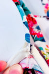 Haut de maillot de bain blanc et rose fleuri pigeonnant seconde main - H&M- La Penderie du Paradis