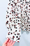 Blouse beige motif leopard avec manches bouffantes (m) -- La Penderie du Paradis ?