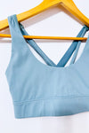 Brassière de sport bleu sauge à dos croisé seconde main - Sabē- La Penderie du Paradis