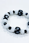 Bracelet billes blanches et noires seconde main Autres