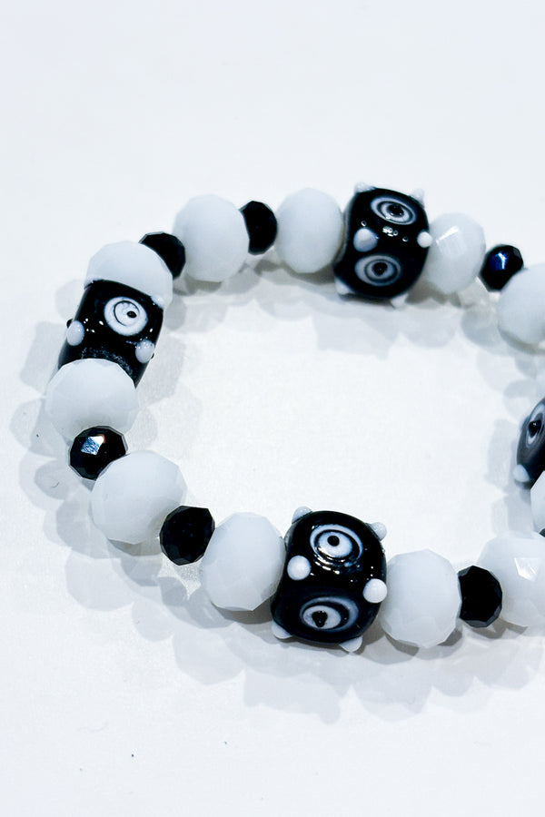 Bracelet billes blanches et noires seconde main Autres