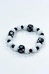 Bracelet billes blanches et noires seconde main Autres