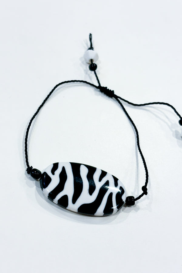 Bracelet noir zébré seconde main Autres