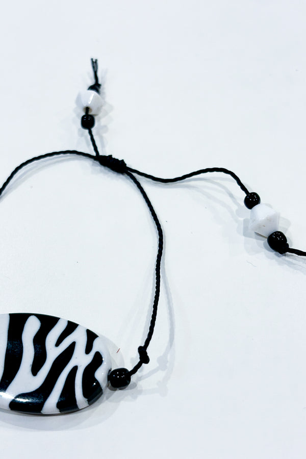 Bracelet noir zébré seconde main Autres