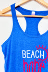Camisole bleue ''Beach babe'' (l) -- La Penderie du Paradis ?