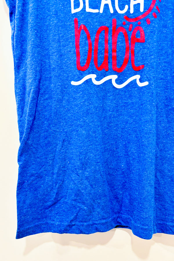 Camisole bleue ''Beach babe'' (l) -- La Penderie du Paradis ?