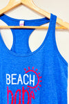 Camisole bleue ''Beach babe'' (l) -- La Penderie du Paradis ?