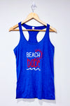 Camisole bleue ''Beach babe'' (l) -- La Penderie du Paradis ?