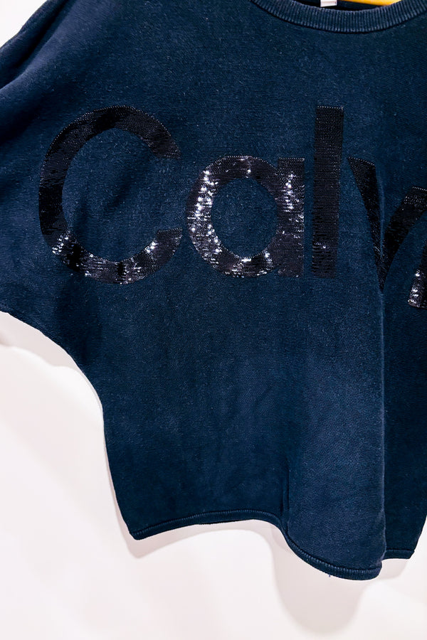 Haut ample noir en tricot avec paillettes (m)-Calvin Klein-La Penderie du Paradis đ