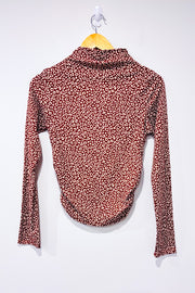 Brown turtleneck sweater with cheetah pattern
