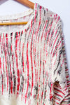 Chandail crème et rouge à ourlet asymétrique seconde main - Liky- La Penderie du Paradis