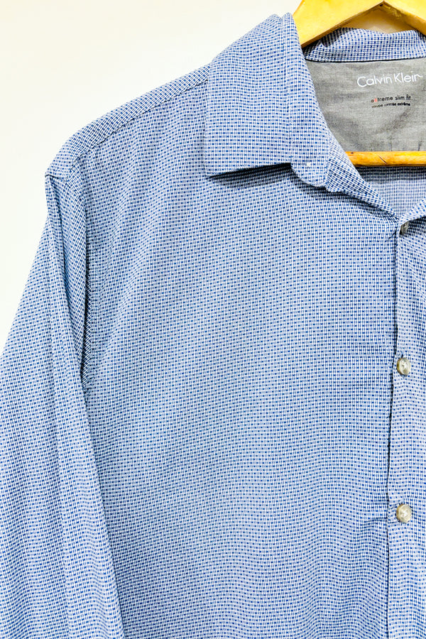 Chemise bleue à motifs (l) -- La Penderie du Paradis ?