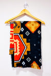 Écharpe oversized en tricot noir et orange à motifs géométriques seconde main - Misk- La Penderie du Paradis