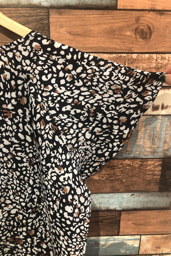 Haut ample noir avec motifs et manches fluides (m) seconde main Autres