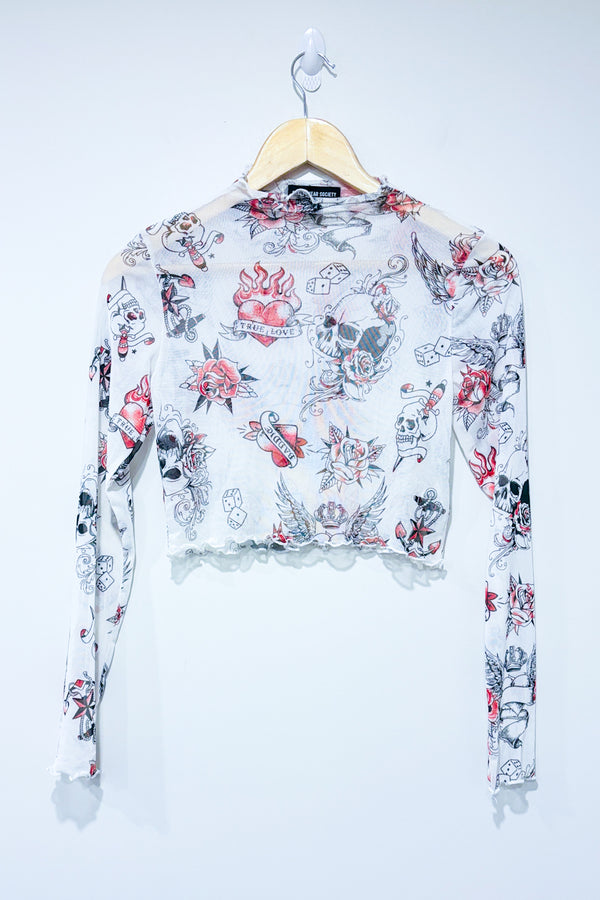 Haut court en maille blanc transparent motif tĂȘte de mort (m) -- La Penderie du Paradis ?