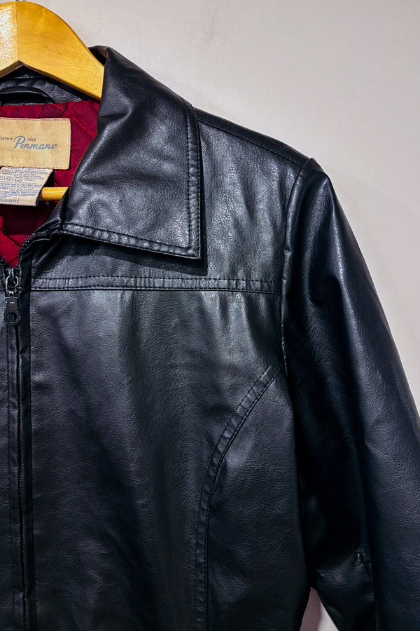 Manteau noir vintage faux cuir avec manches en fausse fourrure seconde main - Penmans- La Penderie du Paradis