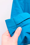 Manteau imperméable turquoise à capuchon seconde main - Outbound- La Penderie du Paradis