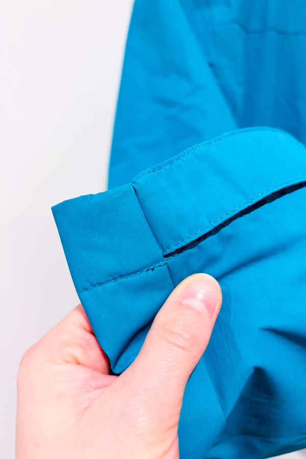 Manteau imperméable turquoise à capuchon seconde main - Outbound- La Penderie du Paradis