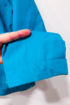 Manteau imperméable turquoise à capuchon seconde main - Outbound- La Penderie du Paradis