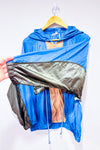 Manteau coupe-vent bleu et brun style vintage seconde main - Out From Under- La Penderie du Paradis