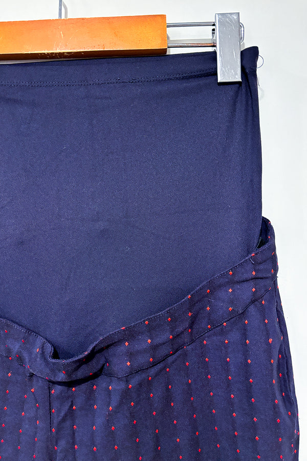 Pantalon marine avec losanges rouges (xs) - Maternité seconde main Stork & Babe
