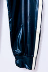 Pantalon jogger noir effet cuir à bandes blanches* seconde main - Norma Kamali- La Penderie du Paradis