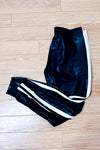 Pantalon jogger noir effet cuir à bandes blanches* seconde main - Norma Kamali- La Penderie du Paradis