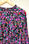 Robe midi noire et rose fleurie (l) seconde main Calvin Klein