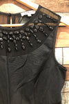 Robe noire avec pierres au col (s) seconde main Airoldi Collection