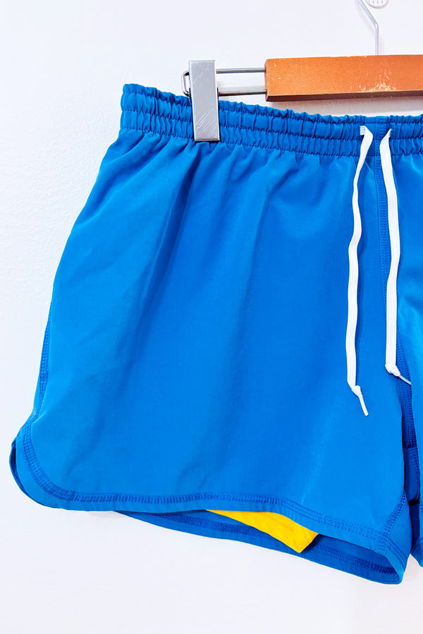 Short Dri-Fit bleu avec short intégré seconde main - Nike- La Penderie du Paradis
