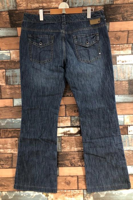 Jeans bleu jambe évasée détails verts (l) seconde main Orage