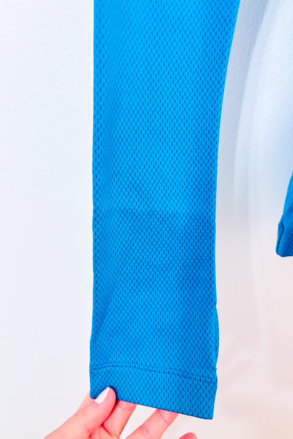 Chandail de sport turquoise à capuchon seconde main - Under Armour- La Penderie du Paradis