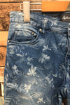 Jeans capri délavé fleuri (s) seconde main Reitmans 