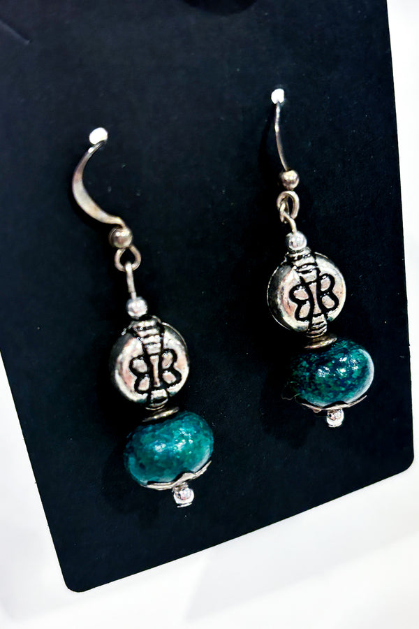 Boucles d'oreilles perle verte et papillon seconde main Autres 
