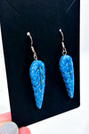 Boucles d'oreilles pendentif plume bleue seconde main Autres 