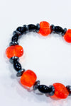 Bracelet billes noires et orange avec tête de mort seconde main Autres 