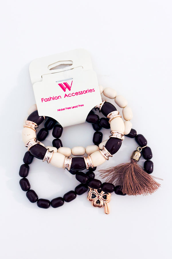 Bracelets extensibles en perles brunes et beiges avec pompon seconde main - Autres- La Penderie du Paradis