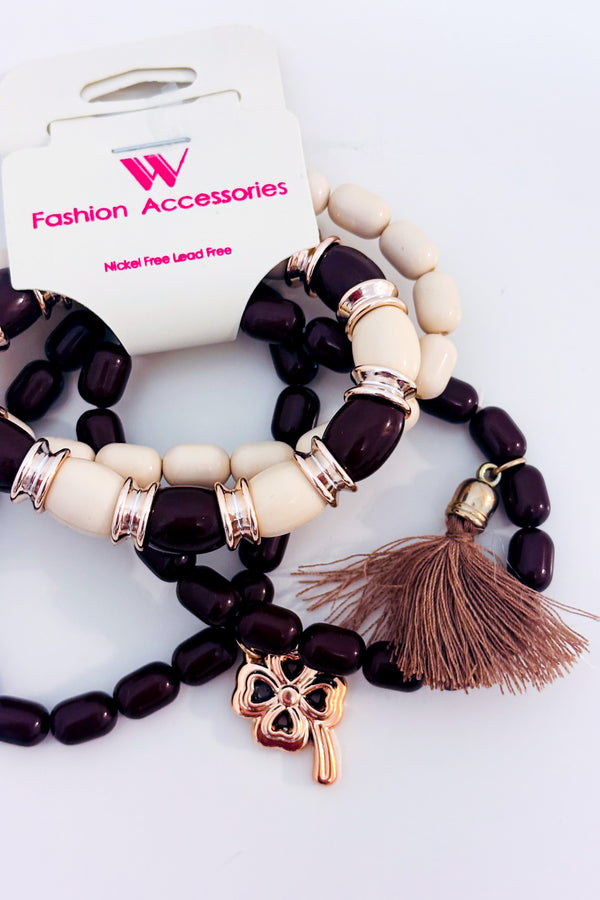 Bracelets extensibles en perles brunes et beiges avec pompon seconde main - Autres- La Penderie du Paradis