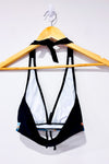 Haut de maillot de bain noir, orange et vert fleuri seconde main - SHEIN- La Penderie du Paradis