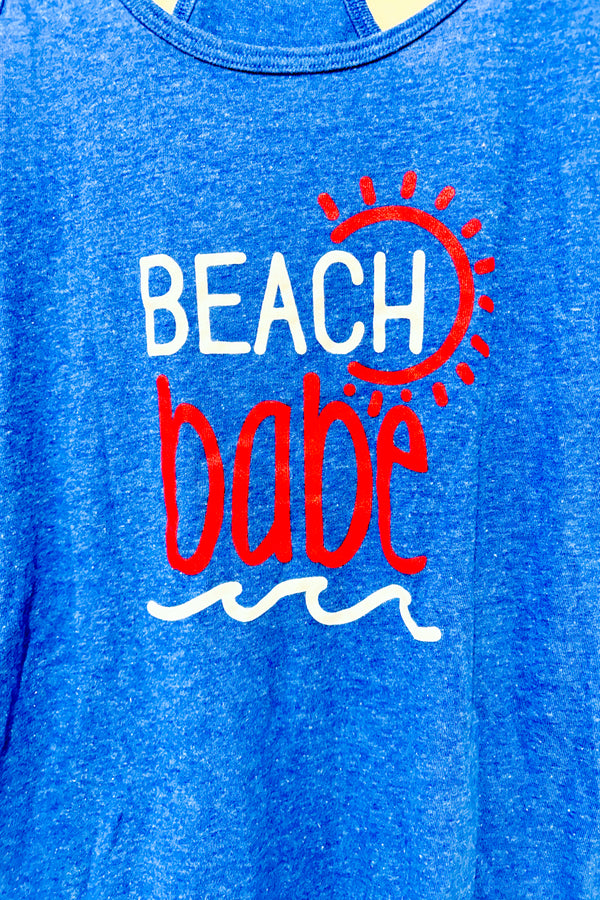 Camisole bleue ''Beach babe'' (l) -- La Penderie du Paradis ?