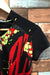 Magasine T-shirt de sport noir rouge et vert (xs/s) - Jamie Sadock à La Penderie du Paradis et trouve des vêtements de sport seconde main pour femmes dans notre friperie en ligne.
