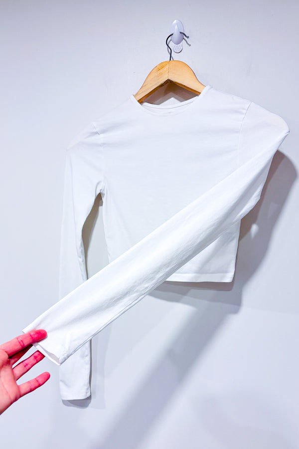 Crop top blanc à manches longue avec ouverture au dos (xs) -- La Penderie du Paradis ?