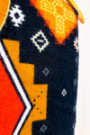 Écharpe oversized en tricot noir et orange à motifs géométriques seconde main - Misk- La Penderie du Paradis
