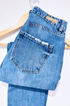 Jeans bleu effet usé jambe droite (xs)