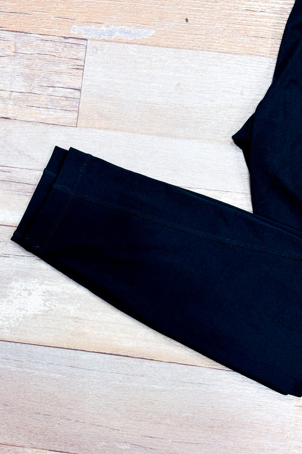 Legging noir à taille haute avec poches* seconde main - Lolë- La Penderie du Paradis