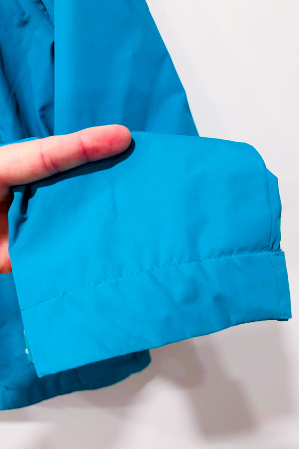 Manteau imperméable turquoise à capuchon seconde main - Outbound- La Penderie du Paradis